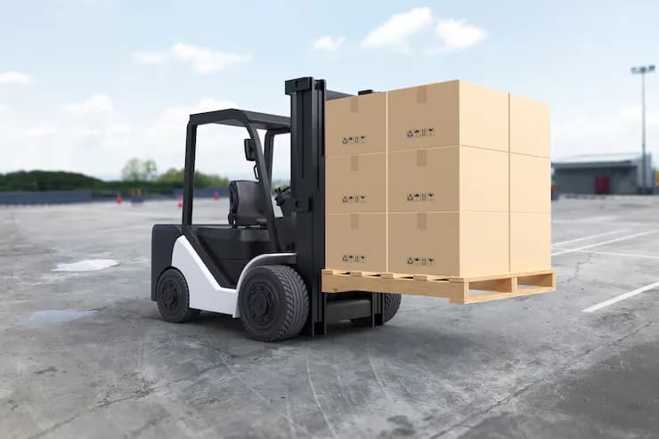 Forklift being loaded onto transport truck